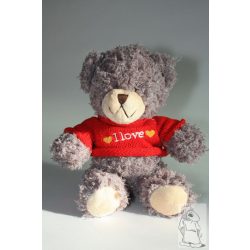 Maci szürke piros pulóverben